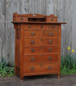Unique Arts and Crafts period eleven drawer highboy dresser chest with Macmurdo feet and heart cut out design Stickley era
